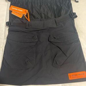 Belt loops and adjustable webbing straps with cinch fastening at waistband.